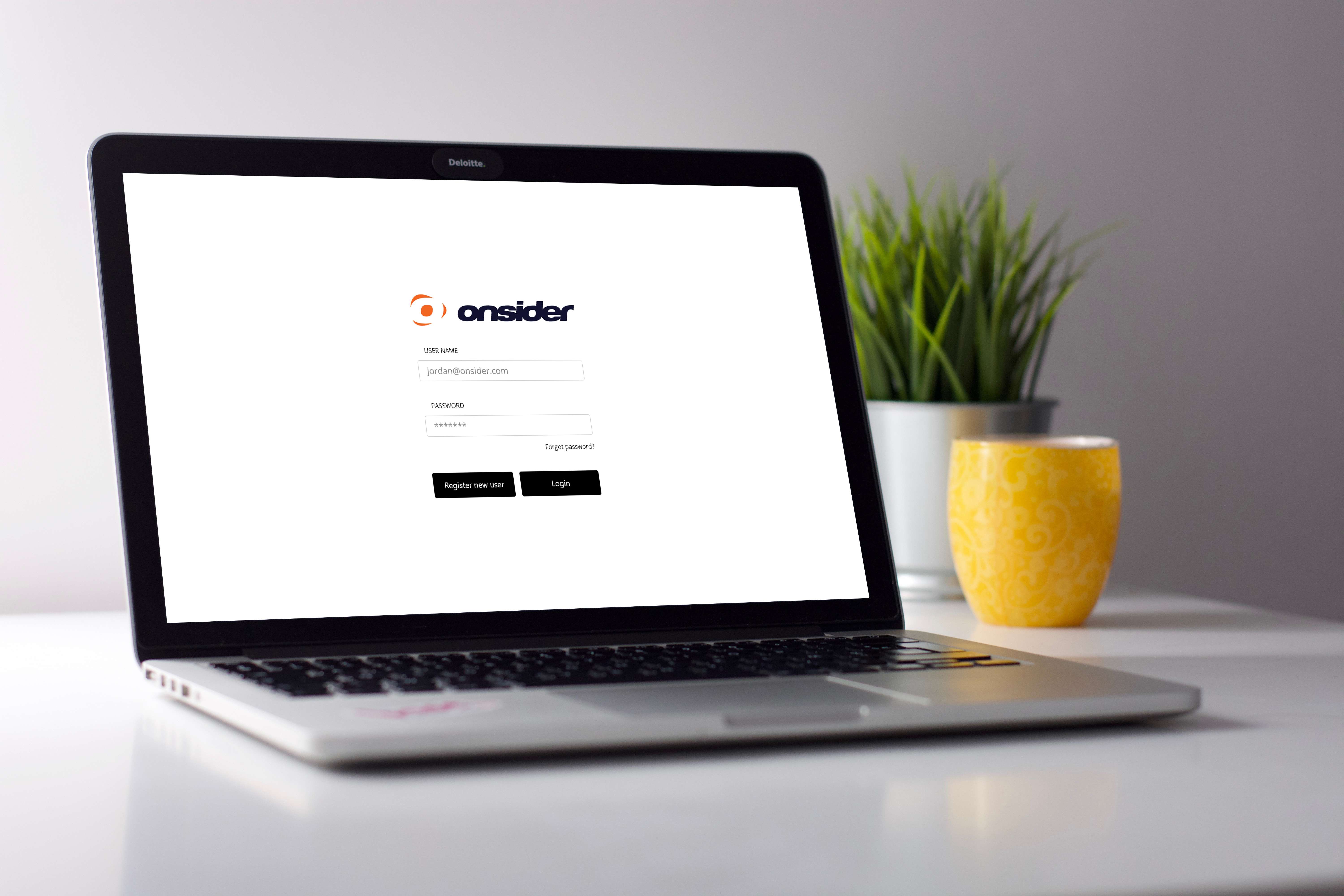 open laptop with the onsider app login on the screen