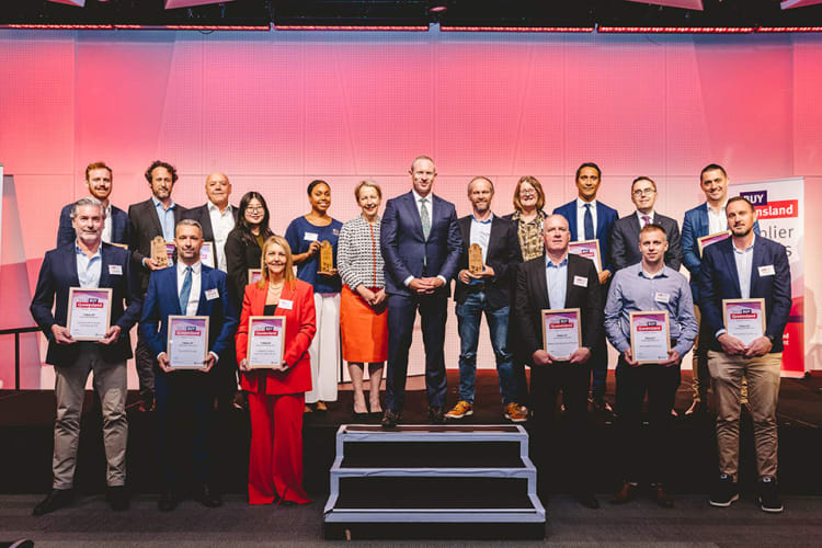 Group photo of the people representing the companies who got the Putting QLD First award